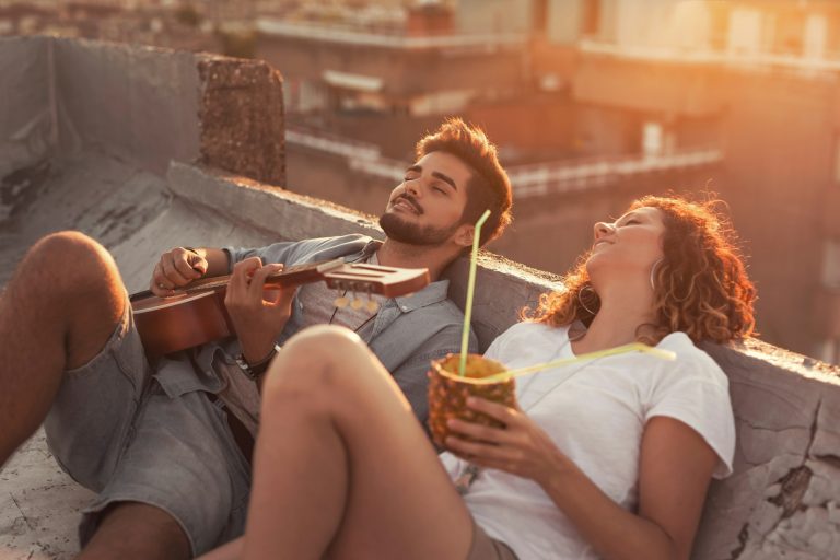 Couple at summer rooftop party